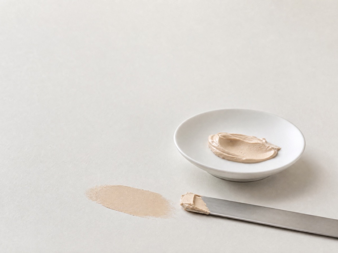 The material, worked flat. A foundation reduces a spread and shifts a mean; those are two different jobs. Made for Percol.