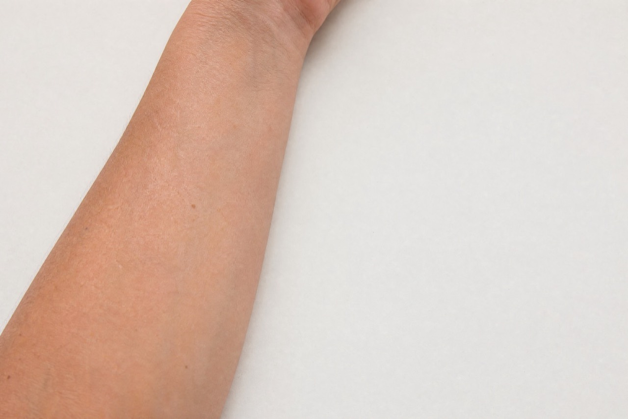 Skin under even, indirect daylight — the only light any of this can be judged in. Made for Percol; not a photograph of an analysis.
