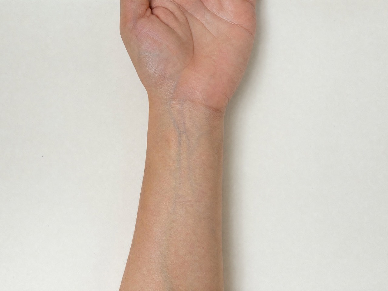 The inside of a wrist, evenly lit. What the vein test asks you to look at, and what it cannot tell you. Made for Percol.